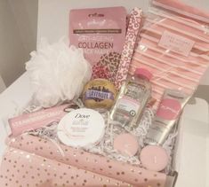 the contents of a pink and gold gift box