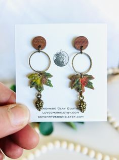 🌿  Handmade - Ready to Ship 🌿 🎁 Free Gift with every order!! 🎁 Limited Edition - Only a few available! Matte finish embossed oak leaf walnut wood post dangle clay earrings, inspired by watercolor, with antique bronze acorns and hoop charms. Walnut 304 stainless steel hypoallergenic earring posts or hooks. These are extremely lightweight, and the perfect gift for fall!  More Autumn Earrings:  https://www.etsy.com/shop/luvccmarie?ref=shop_sugg&search_query=autumn+earring Dimensions: Post Earri Pinecone Earrings, Watercolor Autumn Leaves, Autumn Earrings, Flower Resin Jewelry, Hoop Charms, Wood Post, Fall Earrings, Gift For Woman, Oak Leaf