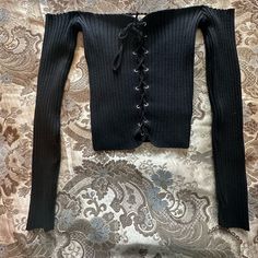 Slightly Cropped Off The Shoulder Long Sleeve Has Hanging Straps New With Tag M/L Size Can Tighten Shirt To Liking But It Would Still Be Visible Thru The Strings Edgy Ribbed Stretch Tops, Black Ribbed Top, Off The Shoulder Long Sleeve, Tops Black, Ribbed Top, Black Rib, Off The Shoulder, Womens Tops, Crop Tops