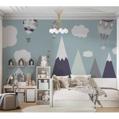 a child's bedroom decorated in blue and white with hot air balloons painted on the wall