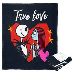 a black blanket with an image of jack and sally from the animated movie, true love