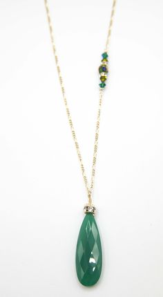 A large Emerald green Adventurine Crystal is adorned with a Swarovski Rhinestone rondelle and cap. 34”in length this amazing necklace is everyday wear or perfect for a dressy occasion. Dangles with easy movement from 14k gold fill or sterling silver. Extremely high quality chain and clasp with all closed jump rings. Side detail makes the necklace absolutely amazing, green Swarovski crystals. Available in Sterling silver or 14K gold fill chain.Custom Length available, just ask!Match with the Lind Elegant Green Onyx Emerald Necklace, Gold Emerald Necklace With Green Onyx Round Beads, Elegant Single Strand Green Onyx Necklace, Handmade Green Onyx Gold Necklace, Adventurine Crystal, Green Onyx Spiritual Necklace, Green Onyx Necklace, Gold Long Necklace, Green Onyx