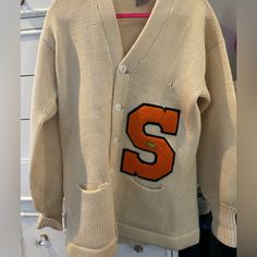 Rare Fine. Oversized Vintage Unisex Syracuse Letterman Cardigan. Some Stain Damage. 100% Wool. Vintage Oversized V-neck Outerwear, Oversized V-neck Vintage Cardigan, Vintage Cotton V-neck Outerwear, Oversized Retro Long Sleeve Cardigan, White Fall Cardigan For College, White Cardigan For College In Fall, Oversized Vintage Spring Cardigan, Oversized Vintage Cardigan For Spring, Retro Cotton V-neck Outerwear