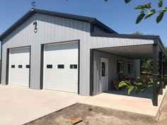 two garages with doors open in front of them