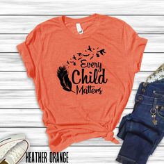 Show your support and raise awareness with our Every Child Matters Orange Shirt collection, designed to honor the lives of Indigenous children, featuring the Every Child Matters slogan with various indigenous graphics and designs. These shirts give a powerful message of unity and support for indigenous communities. Perfect for casual wear or as a statement piece during Indigenous Peoples' Day celebrations. Product features - Unisex fit for versatile styling - Made with lightweight and breathable 100% cotton - Classic crew neckline for easy accessorizing - Manufactured in a humane and sustainable way by Bella+Canvas - Variety of fabric blends for different color options Care instructions - Machine wash: cold (max 30C or 90F) - Non-chlorine: bleach as needed - Tumble dry: low heat - Iron, st Casual Pre-shrunk T-shirt For Awareness Events, Cotton Graphic Print Shirt For Awareness Events, Cotton Shirt With Graphic Print For Awareness Events, Casual Cotton Shirt For Awareness Events, Cotton Tops With Letter Print For Awareness Events, Indigenous Peoples Day, Every Child Matters, Orange Shirt, Shirt Collection