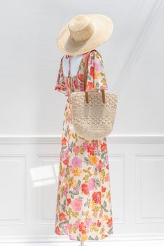 Beige Floral Dress For A Day Out, Beige Maxi Dress For Garden Party, Maxi Dress For Garden Party During Beach Season, Feminine Vacation Maxi Dress, Chic Beige Floral Dress For Spring, Chic Floral Dress For Day Out, Bohemian Floral Dress In Beige, Beige Floral Dress For Spring Day Out, Beige Floral Print Midi Dress For Beach