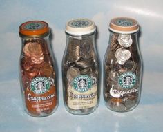 three jars filled with different types of coins