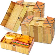 three boxes filled with different types of food