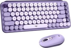 a computer keyboard and mouse sitting next to each other