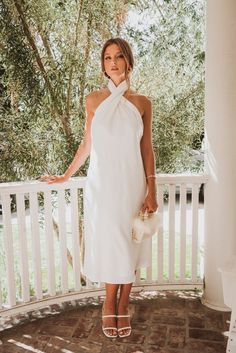 Pre-draped Halter Neck Maxi Dress For Wedding, Chic High Neck Halter Dress With Tie Back, Chic Halter Neck Dress With Wrap-around Straps, Chic Draped Midi Dress For Wedding Guest, Chic Halter Neck Dress For Brunch, Chic Halter Neck Maxi Dress For Wedding Guest, Chic Tie Back Maxi Dress For Wedding Guest, Halter Neck Midi Dress With Tie Back For Wedding, Summer Pre-draped Halter Neck Maxi Dress