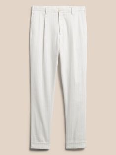 With quality this exceptional, ornamentation is carried away with the wind.  Here, a delightful blend of luxurious linen and soft cotton creates a style lightweight enough to make formalwear a breeze.  Belt optional--we designed this suit pant with a Elegant White Linen Pants, Elegant Linen Dress Pants For Summer, Elegant Summer Linen Dress Pants, Elegant Linen Dress Pants For Spring, Summer Formal Linen Dress Pants, Tailored White Cotton Dress Pants, White Tailored Cotton Dress Pants, Tailored White Linen Pants, White Cotton Dress Pants For Business Casual