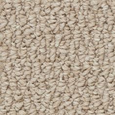 the texture of an upholstered carpet is shown in light beiges and browns