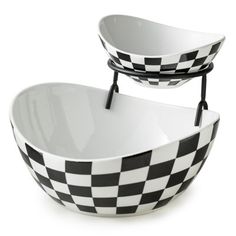 two black and white checkered bowls sitting on top of each other