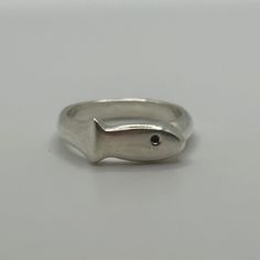 Introducing the Fish Ring. This ring is handcrafted and fashioned from recycled solid sterling silver, embodying a commitment to sustainable design.  Through the hand-finishing process, each Fish Ring carries its own distinctive character, ensuring no two are exactly alike. Funky Rings Silver, Wax Ring Design, Silver Smithing Jewelry, Funky Objects, Style Themes, Silver Smithing, Fish Ring, Wax Ring