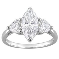 a three stone ring with pear shaped diamonds on the shoulders and sides, set in white gold