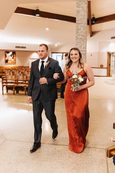 the bride and groom are walking down the aisle