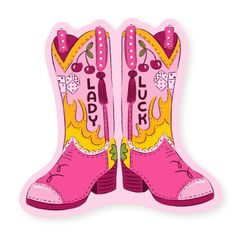 a pair of pink cowboy boots with tassels