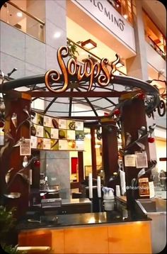 the entrance to soups restaurant in an indoor mall