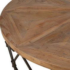 a round wooden table with metal legs