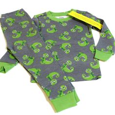 New With Tags Gymboree Vintage Gymmies 2 Piece Pajama Set Gray & Green Dino 100% Cotton Size 2t Retail $21.95 This Snug Fit Pajama Set Includes A Long Sleeve Pajama Shirt And A Pair Of Pajama Pants. It Is New With Tags. Green Dinosaur Print Playwear Sets, Green Dinosaur Print Sets For Playwear, Boy Pajamas, Boys Pajamas, Pajama Shirt, Kids Pajamas, Long Sleeve Pyjamas, Gray Green, Snug Fit