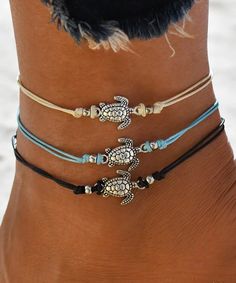 Silvertone & Blue Turtle Anklet - Set of Three. Step up your jewelry rotation with this chic anklet set. Includes three anklets (three pieces total)9.5'' LAdjustableSilvertone brass / waxed cottonImported Beach Toe Nails, Mermaid Outfits, Turtle Anklet, Beach Toes, Blue Turtle, Summer Toe Nails, Mermaid Outfit, Ankle Jewelry, Bracelets Diy