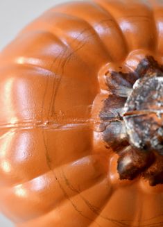 an orange pumpkin sitting on top of a table