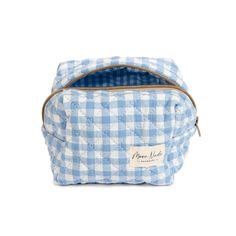 Our Azure Mini Makeup Bag is a stylish and compact carry-all designed to hold your essentials with a classic look. The quilted exterior is made from a beautiful blue gingham material, complemented by a matching gingham interior. Ideal for organizing your makeup and beauty essentials or serving as a travel organizer (especially when you need something more compact than our large bags), this is a must-have for anyone who values both organization and style. Size: 6" x 4" x 5" Blue Quilted Bag For On-the-go, Gingham Bags With Zipper Pouch For Daily Use, Daily Use Gingham Bags With Zipper Pouch, Gingham Pouch Bag For Daily Use, Gingham Interior, Mini Essentials, Surf Room Decor, Surf Room, Mini Makeup Bag