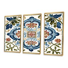 three pieces of art with blue and red designs on the sides, one is framed in gold