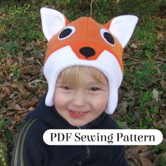 a young boy wearing a fox hat with the words fleece fox hat sewing pattern