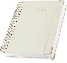 a white notebook with the words notes written in gold foil on it's cover