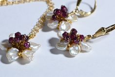 This so feminine jewelry set earrings and pendant Japanese blossom cherry. Craft from natural Keshi Pearl and Rhodolite Garnet wire wrapped 14K gold filled size of this flower 18mm, chain 20 inch secured with trigger clasp earrings : 1 inch with tulip leverback earwire Gold 14/20 New set come in jewelry box. Any question please convo with me, Custom order available ( may be other stone ? I will glad do it for you:-) Thank you for visit my shop Elegant Wire Wrapped Flower Earrings, Flower Shaped Pearl Drop Jewelry As Gift, Flower Shape Pearl Drop Jewelry For Gifts, Flower Shaped Pearl Drop Jewelry Gift, Flower-shaped Pearl Drop Jewelry Gift, Flower Shaped Pearl Drop Jewelry For Gifts, Flower-shaped Pearl Drop Jewelry For Anniversary, Flower Shaped Pearl Drop Jewelry For Anniversary, Elegant Wire Wrapped Flower Shaped Jewelry