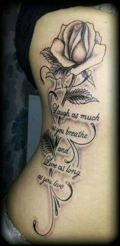 the back of a woman's stomach with a rose on it and words written in cursive writing