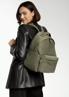 Crafted from our high-quality nylon and designed with ample storage space, the Eli backpack boasts a modern, minimalist design that complements various styles. A dedicated compartment for a 13" laptop, multiple pockets, and organizational features make it ideal for both work and play. Whether you're heading to the office, school, or a weekend adventure with your littles, Eli is the perfect companion. Common Uses: Diaper Bag, Work Bag, Travel Bag Insulated Siding, Unicorn Bag, Stroller Hooks, Backpack Reviews, Work Bag, Backpack Straps, Black Hardware, Monogrammed Items, Black Nylons