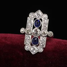 Beautiful Antique Art Deco 18K White Gold Platinum Old Euro Diamond Sapphire Shield Ring. This gorgeous Art Deco diamond and sapphire shield ring is crafted in 18k white gold and platinum top. This ring features gorgeous old cut diamonds on top with two natural royal blue sapphires in the center. This gorgeous ring is in great condition and sits low on the finger.  Item #R1965 Metal: 18K White Gold and Platinum Weight: 5.3 Grams Size: 4 1/2 Diamonds: Approximately 2 cts Color: I - Faint Brown Clarity: SI1 Sapphires: Approximately .60 cts Measurements: Top of the ring measures 25 mm wide and band measures 1.87 mm wide. Measurements off the finger: 3.05 mm high Layaway: For your convenience, we will be happy to provide layaway payment options. Please contact us to work out a layaway plan whi Shield Ring, Antique Art Deco, Art Deco Diamond, Gorgeous Art, Gold Platinum, Blue Sapphire, Platinum, Jewelry Watches, Diamond Cuts