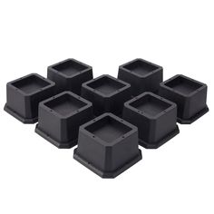 six black plastic square containers on white background