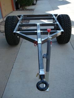 a cart with two wheels on the sidewalk