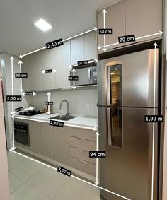 a kitchen with stainless steel appliances and measurements