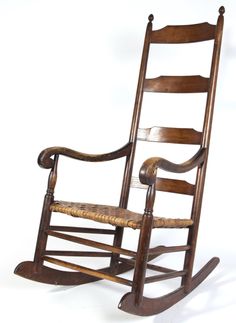 a wooden rocking chair on a white background