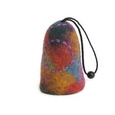 a multicolored felt bag with black string