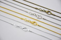 Length: 10 necklace Diameter: 1.2mm Color: you choose Length: 51cm(20'') Material: metal Metal Snake Chain Necklace Gift, Gift Snake Chain Necklace With Delicate Chain, Metal Snake Chain Necklace With Lobster Clasp As Gift, Metal Snake Chain Necklace With Lobster Clasp, Gift Metal Snake Chain Necklace With Lobster Clasp, Diy Chain, Stainless Steel Chain Necklace, Snake Chain Necklace, Jewelry Chain