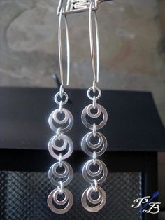 "Earrings made using all of our sterling silver handmade components. They hang about 3\" from top of ear wire. Nice and lightweight! All of our jewelry will arrived boxed and ready to give as a gift. Please email us if you have any questions. Made to order Θ Allow up to 14 business days before shipment Θ VISIT OUR SHOP: http://www.PoseidonsBooty.etsy.com SHOP POLICIES: http://www.etsy.com/shop/PoseidonsBooty/policy" Handmade Long Drop Hoop Earrings In Sterling Silver, Silver Sterling Long Drop Hoop Earrings, Handmade Silver Sterling Linear Earrings, Silver Sterling Silver Linear Earrings With Ear Wire, Adjustable Long Drop Linear Earrings In Silver, Silver Linear Sterling Silver Earrings With Ear Wire, Sterling Silver Round Linear Earrings, Adjustable Long Drop Silver Linear Earrings, Silver Wire-wrapped Dangle Linear Earrings