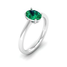 This elegant ring features a stunning oval emerald stone set in lustrous white gold. The vibrant green hue of the emerald is beautifully complemented by the brilliance of the white gold band, creating a timeless and sophisticated piece of jewelry. Metal: 14K Gold Setting Type: Prong Rhodium Finish: Yes, on White Gold Gemstone Details: Gemstone: Emerald Shape: Oval Average Dimensions: 8.00 x 6.00 MM Quantity: 01 Average Cut: Very Good Average Color: Medium to Dark Green Average Clarity: Eye Clean Fine Jewelry Emerald Green Oval Cabochon Ring, Green Oval Cabochon Emerald Ring, Oval Tsavorite White Gold Ring, Oval Tsavorite Ring In White Gold, Oval Emerald Ring With Prong Setting, Modern Green Oval Rings, Oval Emerald Birthstone Ring In White Gold, Oval Emerald Birthstone Ring For May, Oval Emerald May Birthstone Ring