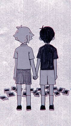 two people are holding hands and looking at each other