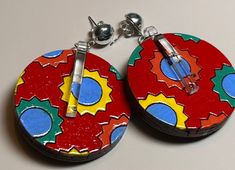 Hand painted, laser cut and designed by us, these one and a half inch diameter wooden earrings are colorful, light, and just so fun! Silver plated post. Laser Cut Earrings Acrylics, Tiny Paintings, Earrings Wood, Laser Cut Earrings, Jewelry Flower, Painted Earrings, Painted Jewelry, Art Earrings, Paintings Art