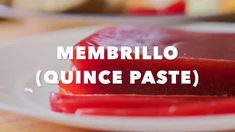 a plate with some food on it and the words membrilo quince paste