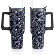 two travel mugs with floral designs on the front and back, one is black