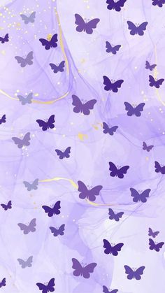 purple butterflies are flying through the air