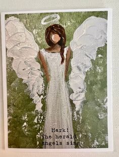 an angel card with the words heart, the herald angels sit on it's wings