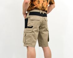 "Vintage cargo style shorts in beige-black - zip fly - 5 main pockets and few smaller - elastic waist - high waist - materials: 65% polyester 35% cotton CONDITION (1-10) - 9 - Great condition SIZE/MEASUREMENTS size from label: 52 best fits men: L MANUAL MEASUREMENTS waist: 34-36 inches (88-92 cm) hips: 46,5 inches (118 cm) rise: 11,5 inches (29 cm) length: 23 inches (59 cm) inseam: 12 inches (31 cm) The model is 6'1\" (186 cm), measures 41-35-39 (104-88-100 cm)." Urban Shorts With Belt Loops For Summer, Beige Cotton Cargo Shorts With Belt Loops, Urban Summer Shorts With Belt Loops, Casual Beige Shorts With Belt Loops, Beige Cotton Shorts With Belt Loops, Beige Utility Cargo Style Shorts, Beige Utility Cargo Pants Short Length, Casual Beige Cargo Shorts With Belt Loops, Beige Cargo Shorts With Multiple Pockets For Summer