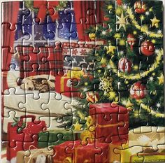 a jigsaw puzzle with a christmas tree and presents